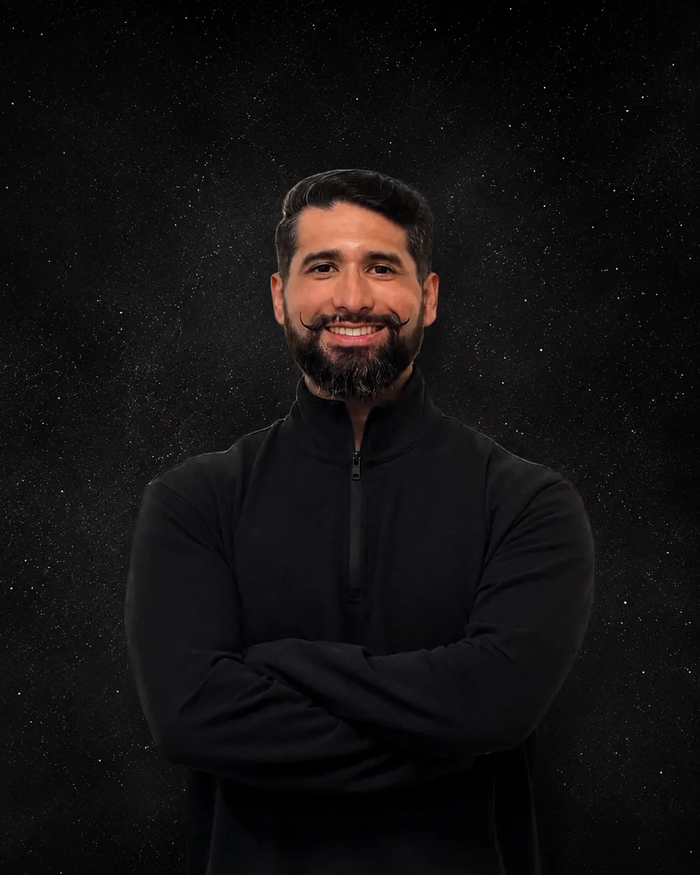 Portrait of Dr. Alexzander Rodriguez smiling with arms crossed