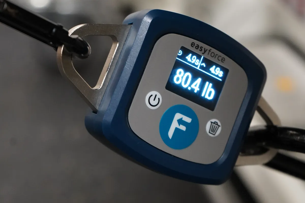 Digital force gauge displaying an 80.4-pound strength test reading