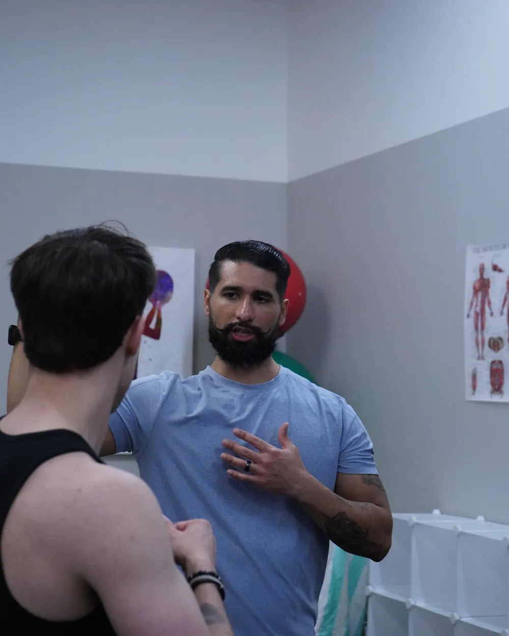 Dr. Rodriguez talking with a client in the clinic, explaining the plan